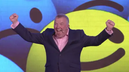 Michael presenting live, colourful background